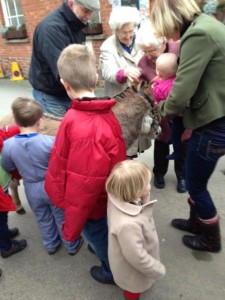 Monty, our Miniature Donkey stallion celibrates Palm Sunday with the local children